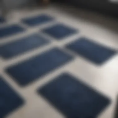 Variety of navy bathroom mats displayed in a showroom