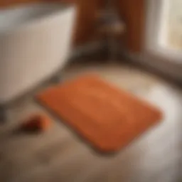 Elegant orange bath mat set on a polished wooden floor